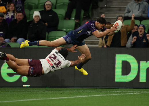 Melbourne’s Xavier Coates crosses for one of his two tries on Saturday night.