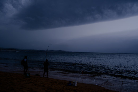 Fisherman at Fisherman’s Beach north of Long Reef, before today's thunderstorm. 