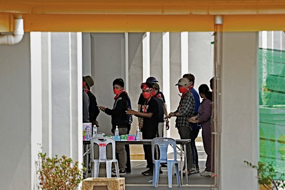 Indonesian trafficking victims wait to be processed at the Thai border after being released.