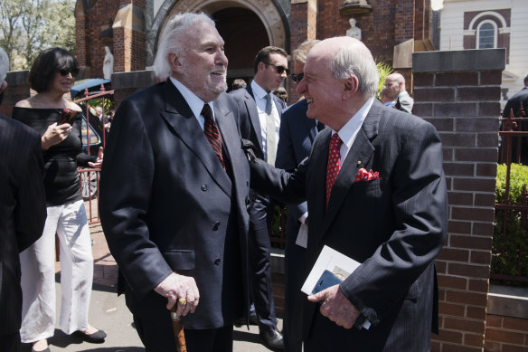 John Laws and Alan Jones catch up at Friday's funeral for John Fordham.