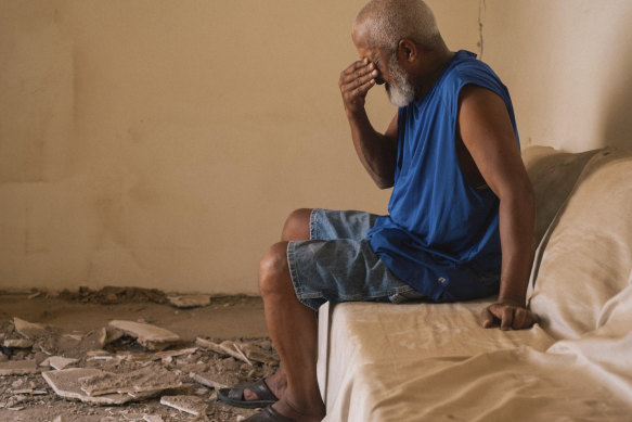A man reacts as he speaks about the damage caused by the earthquake to his home, in the historical district of Marrakesh, Morocco.
