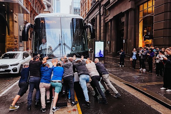 Dutton’s travelling media bus gets stuck on a cycle lane kerb when leaving the Fullerton Hotel in Sydney.
