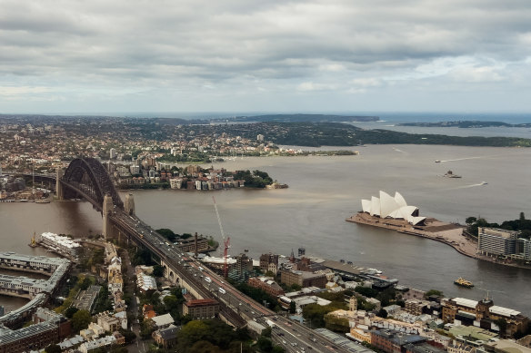 The view from the Sky Deck at Crown Casino show storms have turned Sydney Harbour a murky shade of brown.