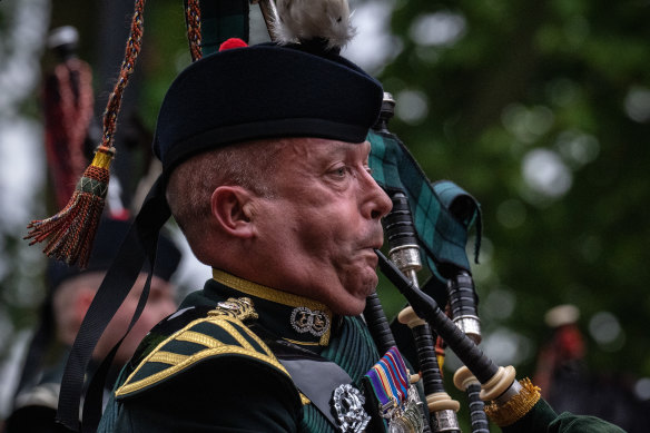 Imagine waking up to this every morning: A piper at a rehearsal for the Queen’s Platinum Jubilee pageant in May.
