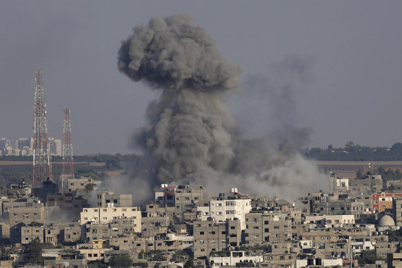 Smoke rises after Israeli airstrikes on a residential building in Gaza, on Sunday August 7.