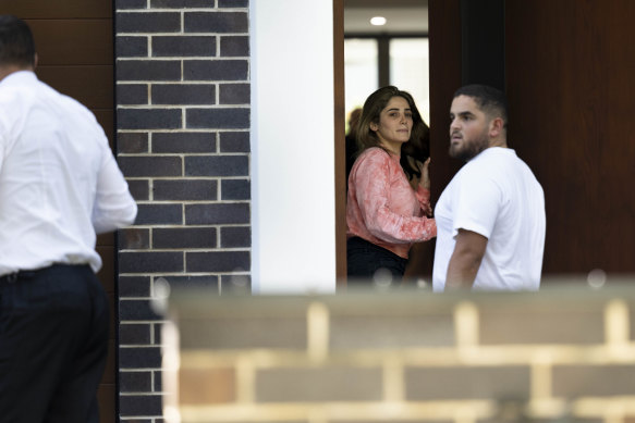 Ashlyn Nassif arrives at a property after being released from custody this afternoon.