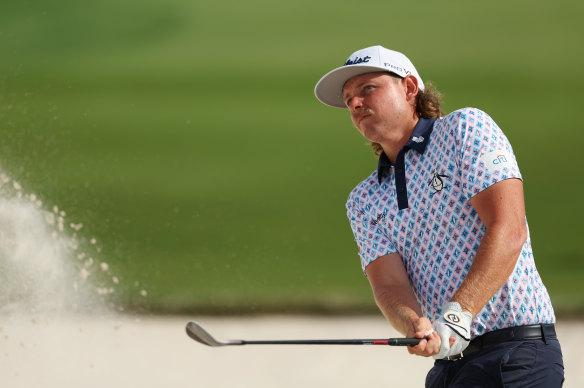 Cameron Smith playing a shot from the bunker on the 18th hole at The Australian Golf Course on Friday.