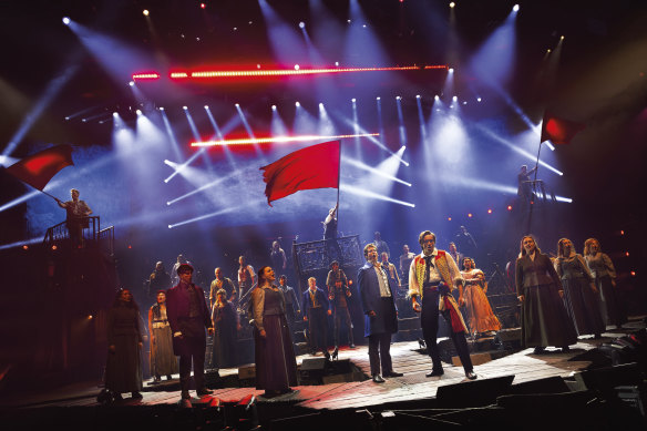 The cast wave the flag for Les Miserables - The Arena Spectacular. 