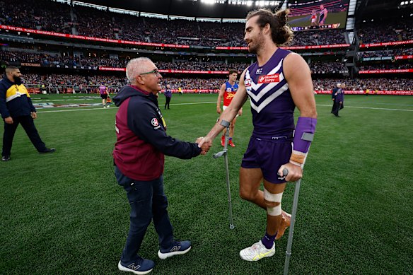 Dockers captain Alex Pearce and Brisbane coach Chris Fagan shake hands after the Lions clinched the decider in the dying minutes. 