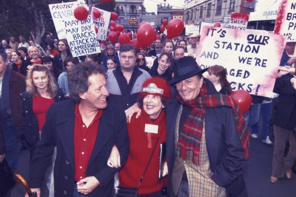 Mary Drost joined by actor Geoffrey Rush and the late comedian Barry Humphries at Camberwell Railway Station.
