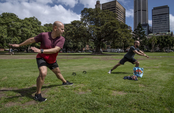 Tony Gonzalez and Brendan Crozier train - at the required social distance - at The Domain after their gym shut down. 