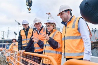 Victorian Premier Daniel Andrews (centre), Transport Infrastructure Minister Jacinta Allan (right) and Rail Projects Victoria head Evan Tattersal at the North Melbourne Metro tunnel site.