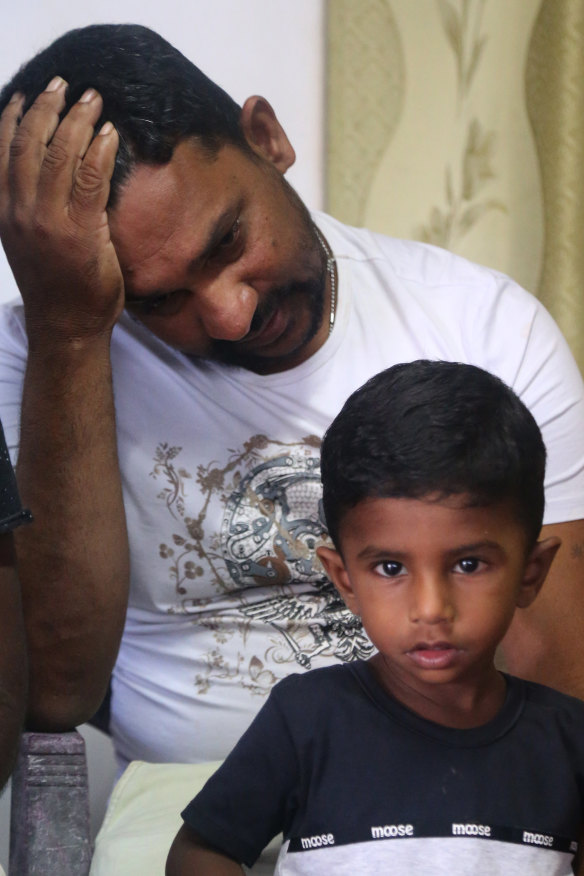 Father-of-three Warnakulasuriya Meril Christopher with one of his children.