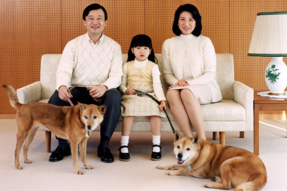 Naruhito, Masako and Princess Aiko with their dogs, Pippi and Mari, in 2007. 