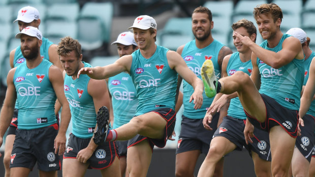 Dane Rampe (far right) and Swans teammates prepare for round one.