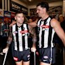 Jamie Elliott and Scott Pendlebury in the rooms post-game.
