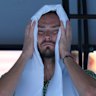 Daniil Medvedev takes a moment in the shade during his third-round match.