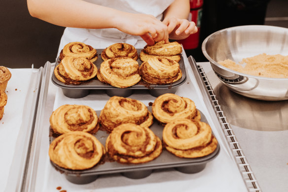 Morning buns, made with a swirl of cinnamon-topped croissant dough, being prepared at Lune Rosebery.