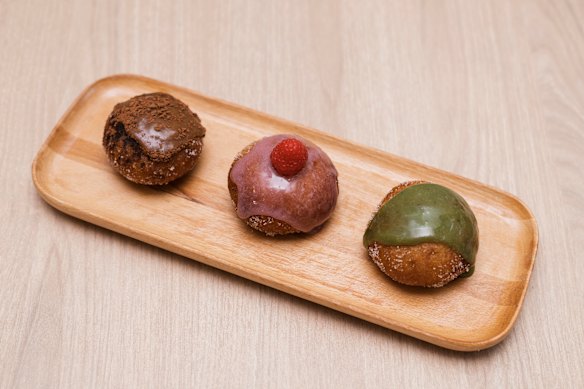 Mocha, raspberry and matcha sourdough doughnuts. 