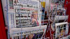 The Daily Telegraph and Daily Mail newspapers on display in London.