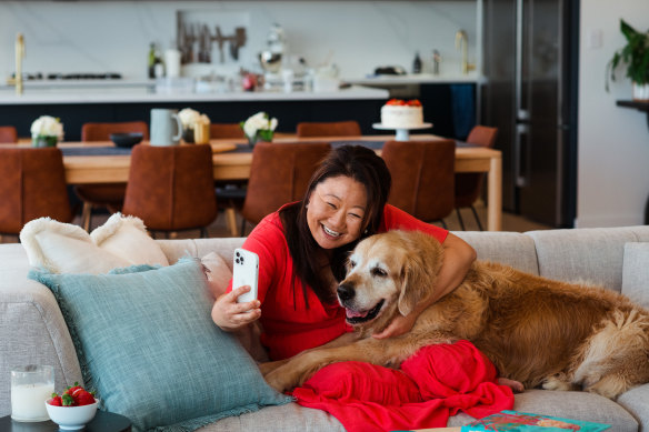 Maehashi at home with her golden retriever, Dozer. 