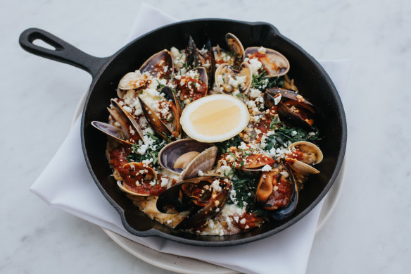 Go-to dish: shellfish saganaki. Once the shells open in the oven, ouzo cream and sheep-milk feta are added.