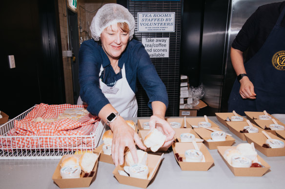 Caroline Greig from CWA Taralga branch busy plating scones. 