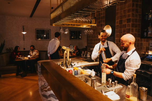 The large bar has magnificently streaked marble.