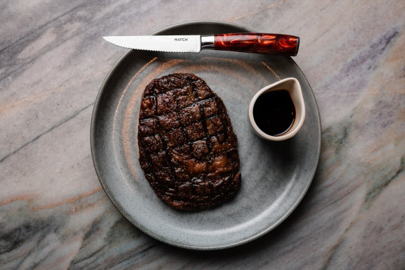 A grill-marked Portoro MB4+ grain-fed rib-eye.