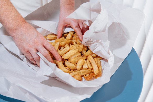 Beef dripping chips in paper.