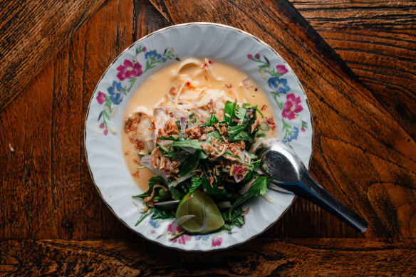 Steamed fish with coconut milk, fresh herbs and makrut lime leaf at Joe’s Table.