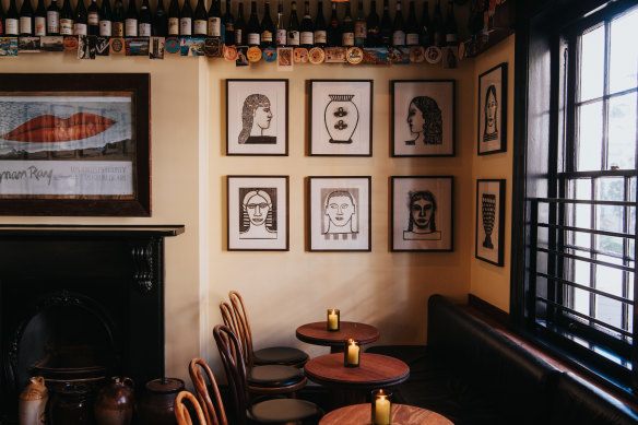 Vintage coasters and Allie Webb artworks decorate the wine bar. 