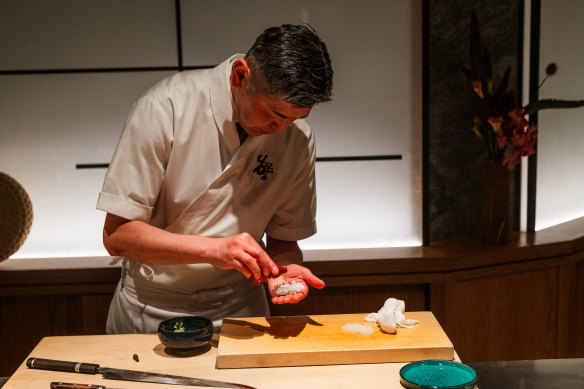 Yoshii Ryuchi preparing squid. 