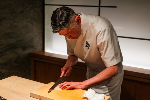 Yoshii Ryuchi slicing sashimi. 