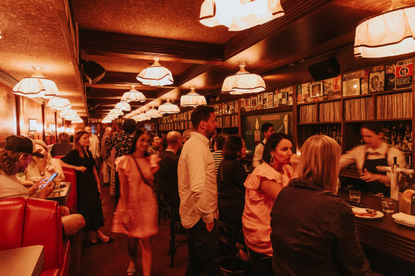 Some of the 10,000 records in Caterpillar Club’s epic collection are displayed behind the bar.