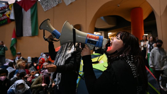 A group of students occupy the Arts West building at Melbourne University’s Parkville campus on Wednesday. 
