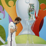 So close, but so far: Harry Kane walks past the trophy after losing the Euro 2020 final on penalties.