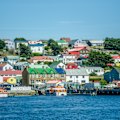 Colourful harbourside homes dominate the barren landscape.