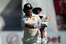 Matt Renshaw swings his bat as he leaves the field following his dismissal on day four.