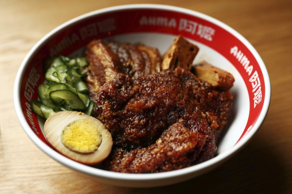 Try the braised pork belly over glistening rice in a “deluxe” bowl...