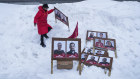 A woman arranges campaign posters in Nuuk, Greenland.