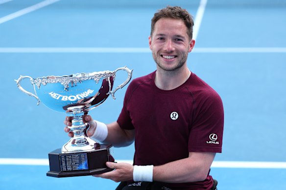 Alfie Hewett, of  Britain, with the trophy after winning the men’s wheelchair singles final.