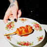 Plant-based corn dog with golden curry ketchup and mustard seeds at Smith + Daughters Social Club.