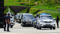 Prime Minister Muhyiddin Yassin’s convoy departs the Istana Negara palace in Kuala Lumpur on Monday.