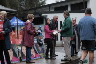 The Labor candidate for the seat of Reid Sally Sitou and supporters at the pre-polling booth in Homebush West on Wednesday.