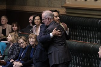 Sydney MP Alex Greenwich hugs fellow independent MP Greg Piper as the bill passed. 