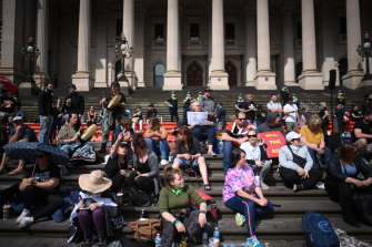 Protesters gather at on the steps of Parliament on Wednesday.
