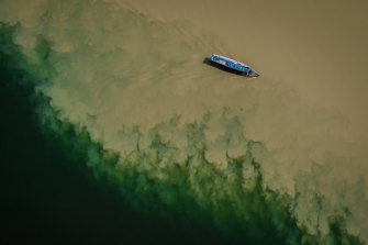A boat passes through the meeting of the Xingu River and the Rio Fresco in Sao Felix do Xingu.
