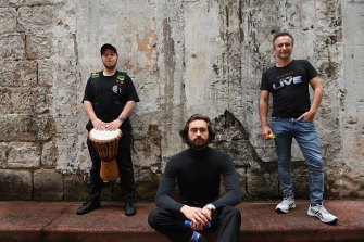 Musicians Joel Kassel (left), Jaspar McCahon-Boersma (centre) and Logan McCrory (right), who attended State Parliament in support of the call for a minimum wage.
