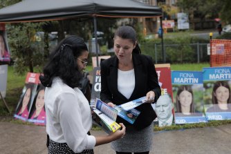 Liberal MP Fiona Martin speaks with voters in Reid after the 2GB interview on Wednesday.